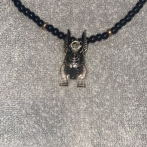 Egyptian Anubis head necklace.